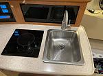New sink,cooktop, and faucet in galley.